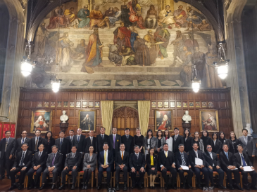A group of Thai Judges (men and women) are pictured in a formal group photo.